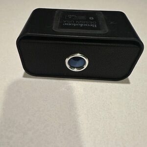 Brookstone Black Portable Mini Speaker with Blue Accent
